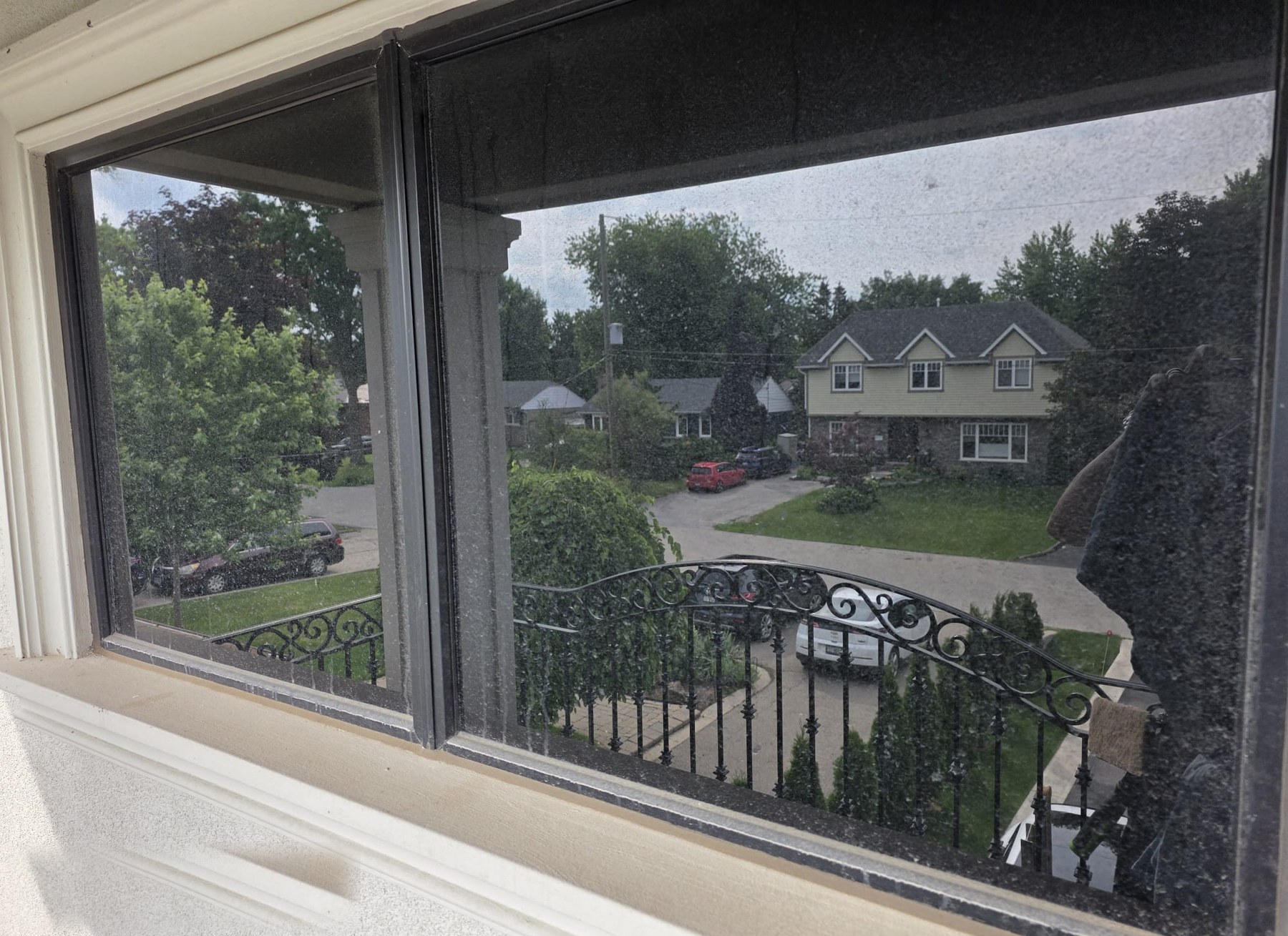 Before: dirty residential window, glass dull with grime.